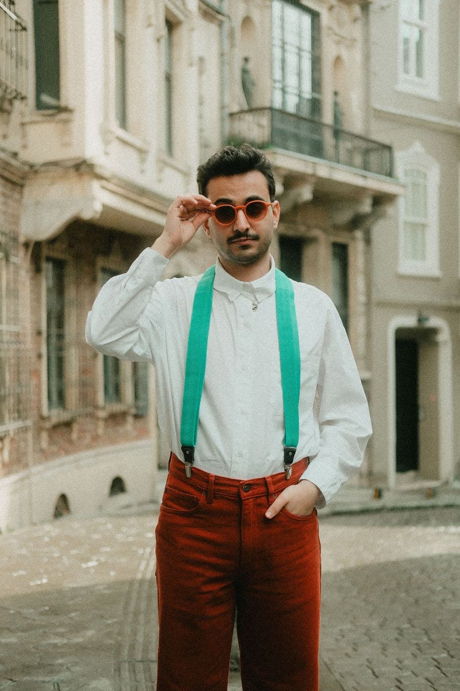 Man in rust corduroy trousers and braces