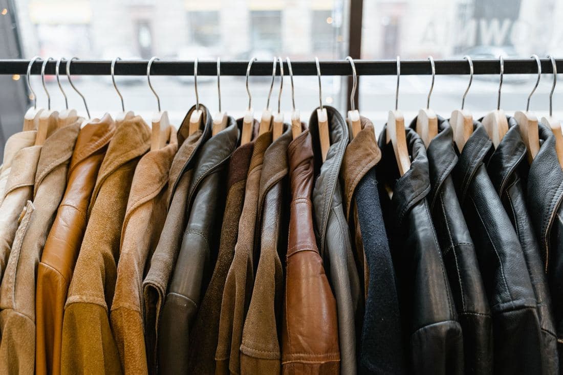 A rail of vintage leather and suede jackets