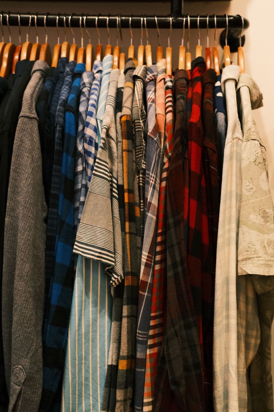 A long rail of patterned vintage shirts in the shop